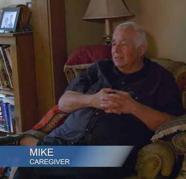 A caregiver, Mike, is shown